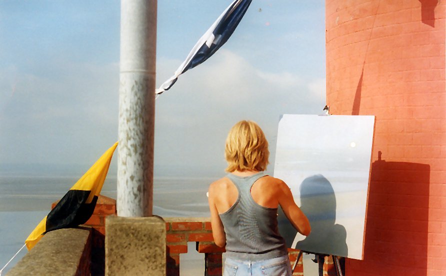 Pippa painting on a rooftop